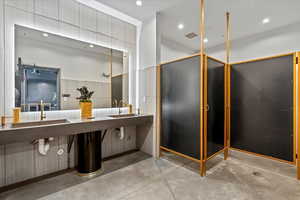Full bath with concrete flooring and recessed lighting