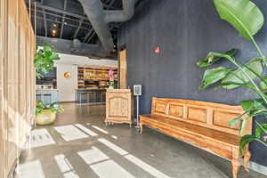 Living area featuring a towering ceiling