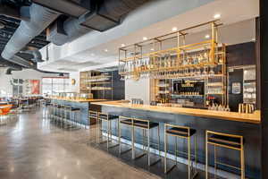 Community bar area featuring butcher block countertops and recessed lighting