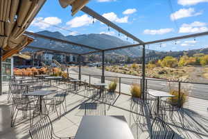 View of patio featuring outdoor dining space and a mountain view