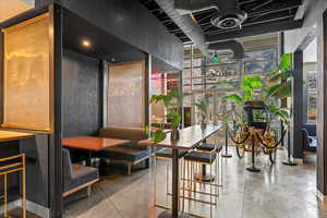 Common area featuring floor to ceiling windows