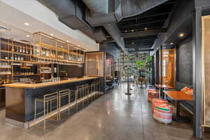 Bar with a wall of windows and recessed lighting