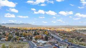 Aerial perspective of suburban area featuring a mountain backdrop