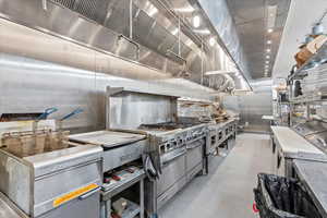 Kitchen featuring range hood