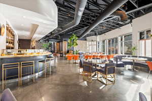 Dining area featuring concrete floors and recessed lighting
