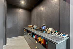 Bar with concrete flooring and modern cabinets