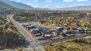 View of property location with a mountainous background and a tree filled landscape