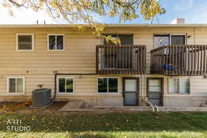 Back of property featuring a balcony