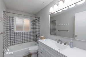 Full bath with shower / bath combination with curtain and vanity