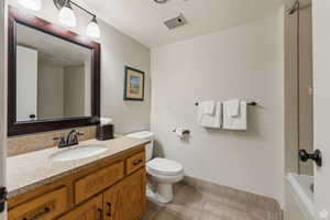 Bathroom with vanity and light tile patterned floors