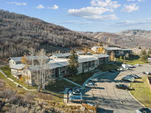 View of subject property featuring a mountainous background
