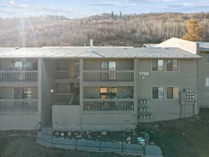View of building exterior with a forest view