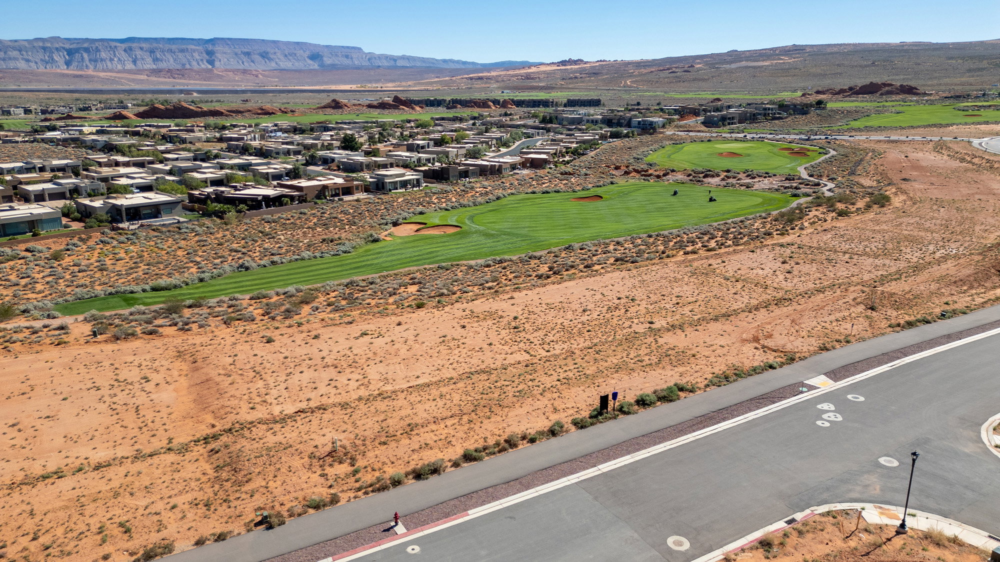 Aerial view of residential area featuring a mountain backdrop