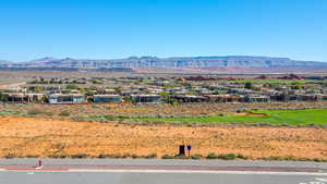 View of mountain backdrop featuring nearby suburban area