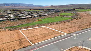 Aerial perspective of suburban area with a mountainous background and property boundaries highlighted