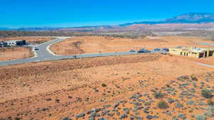 Drone / aerial view of a mountainous background and a desert landscape