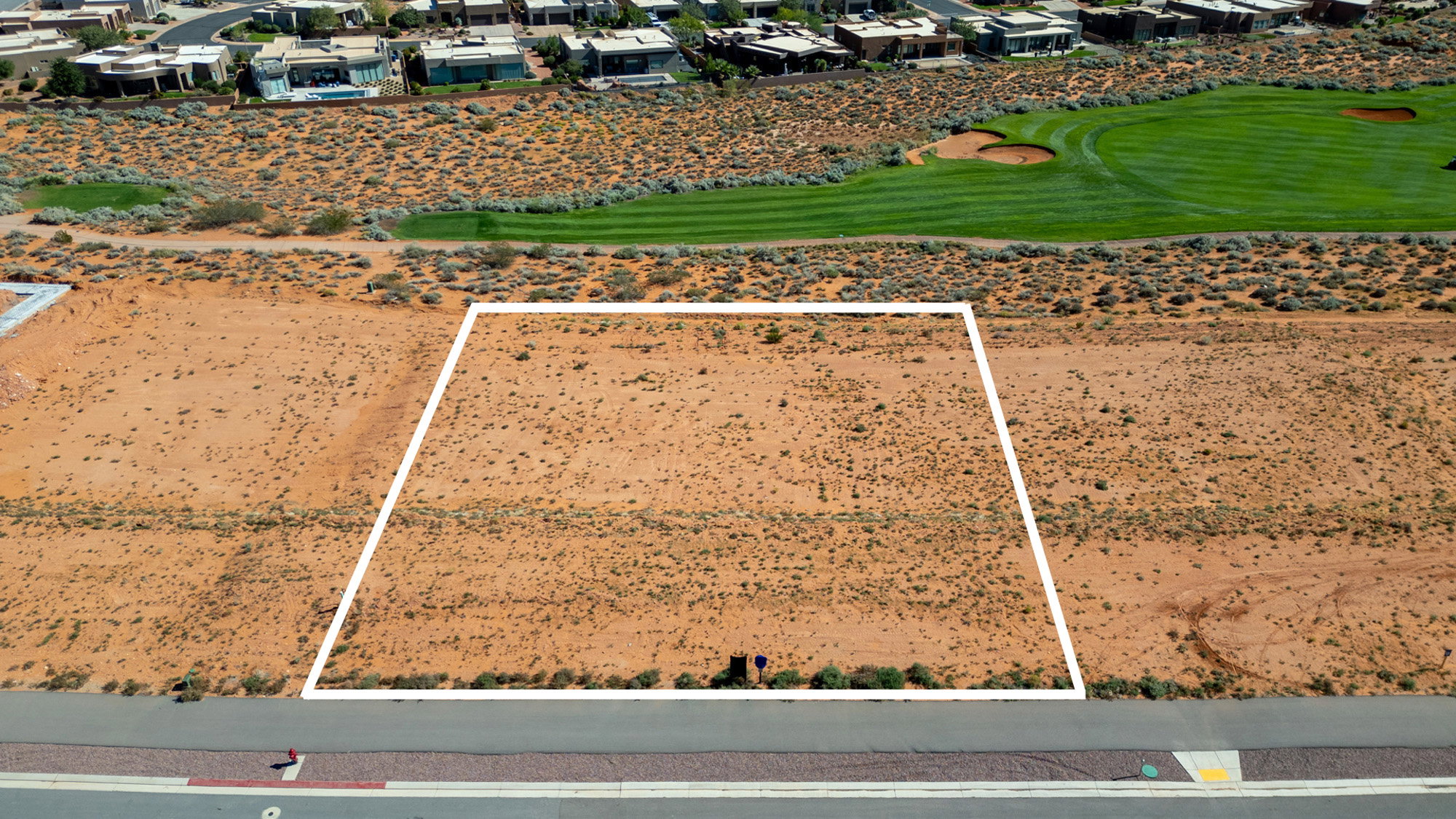 Aerial perspective of suburban area featuring property boundaries highlighted