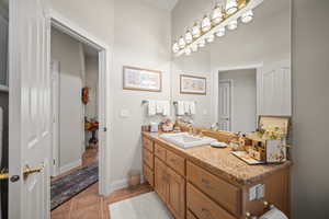 Bathroom featuring vanity and light tile patterned flooring
