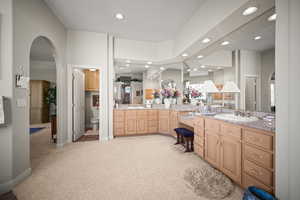 Full bathroom featuring light colored carpet, recessed lighting, and vanity