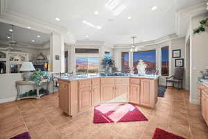 Kitchen with ceiling fan, recessed lighting, light stone countertops, open floor plan, and light tile patterned flooring