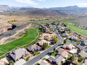 View of property location with a mountain backdrop and nearby suburban area