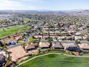 Aerial view of residential area featuring a local golf course and a mountainous background