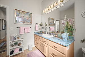 Bathroom featuring vanity and light tile patterned floors