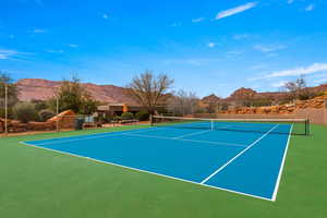 View of tennis court featuring a mountain view