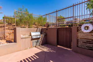View of patio featuring an outdoor kitchen