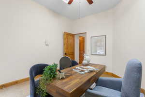 Office area featuring baseboards and a ceiling fan