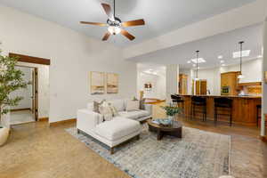 Living area featuring a ceiling fan, a skylight, and recessed lighting