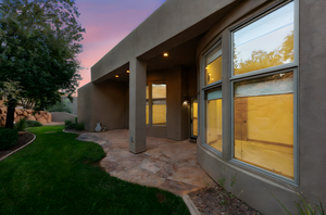 Patio terrace at dusk with a patio area and a yard