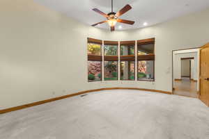 Empty room with light carpet, recessed lighting, and ceiling fan