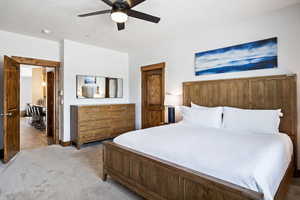 Bedroom featuring carpet flooring and a ceiling fan