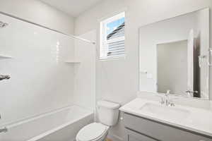 Full bathroom with vanity and bathing tub / shower combination