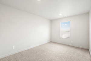 Spare room with carpet flooring and recessed lighting