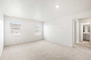 Unfurnished room featuring light colored carpet and recessed lighting