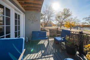 Wooden terrace featuring an outdoor hangout area