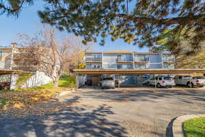View of front of house featuring covered parking