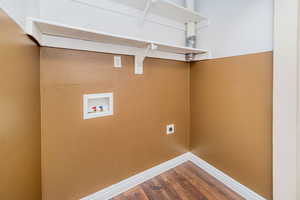 Laundry area featuring hookup for a washing machine, dark wood-type flooring, and electric dryer hookup