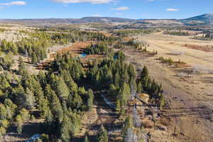 Aerial view of property's location with mountains