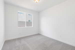 Unfurnished room with carpet floors and baseboards