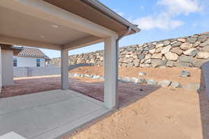 Fenced backyard with a patio area