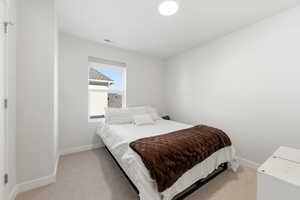 Bedroom with light carpet