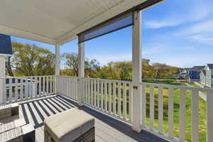 View from upstairs balcony overlooking creek and tree line