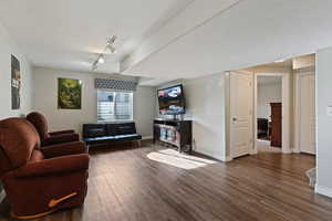 Living room featuring wood finished floors and track lighting