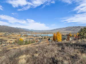 View of mountain backdrop featuring a large body of water