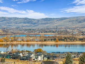 Water view with nearby suburban area and mountains