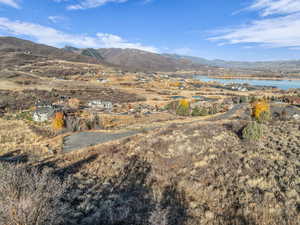 View of mountain background with a large body of water and nearby suburban area