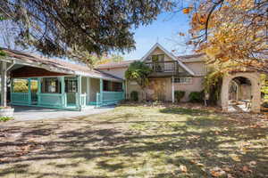 Back of property featuring a yard